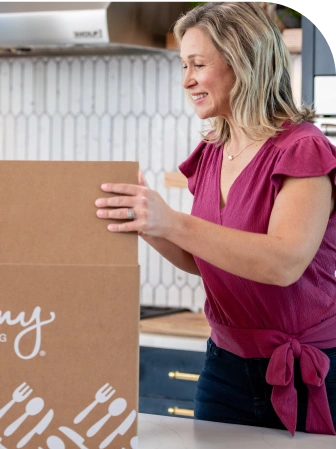 woman opening jenny craig delivery