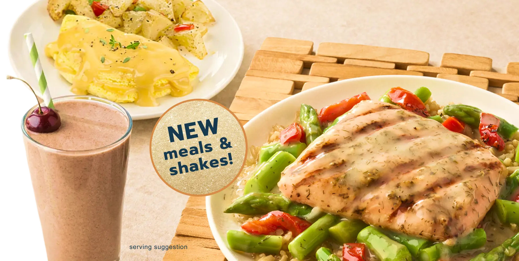 Woman smiling, holdng a chocolate shake - by popular demand, shakes are here!